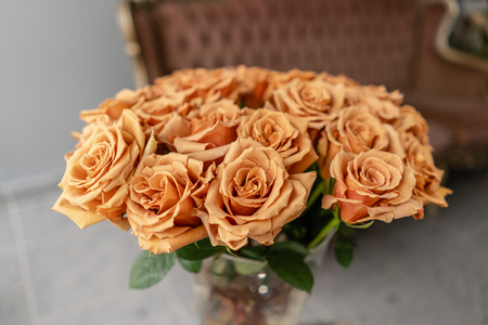 Caramel color, tofi roses in a glass vase. Beautiful rose flower for catalog or online store. Floral shop concept . Beautiful fresh cut bouquet. Flowers deliveryの写真素材