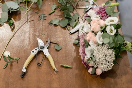 Master class on making bouquets. Summer bouquet. Learning flower arranging, making beautiful bouquets with your own hands. Flowers deliveryの写真素材