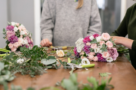Master class on making bouquets. Summer bouquet. Learning flower arranging, making beautiful bouquets with your own handsの写真素材