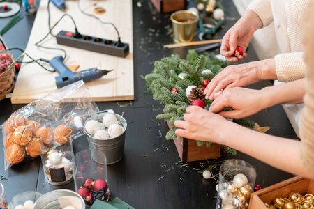 Christmas decor with their own hands. Woman created a xmas arrangement. Master class on making...