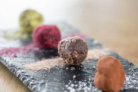 Candy chocolate truffle. Breakfast in the cafe, morning coffee. on wooden table. Restaurant menuの写真素材