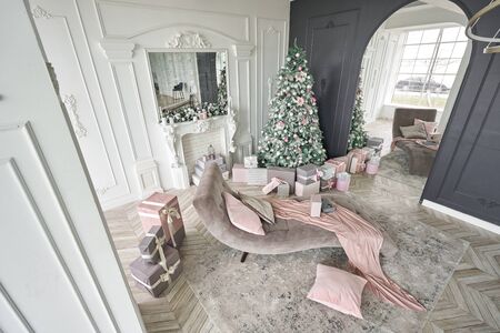 Christmas morning. Classic luxurious apartments with decorated christmas tree and presents. Living...