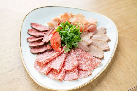 Meat plate, delicacy and Anantipasto. Salami, roast beef, Parma ham, smoked duck breast. Restaurant...