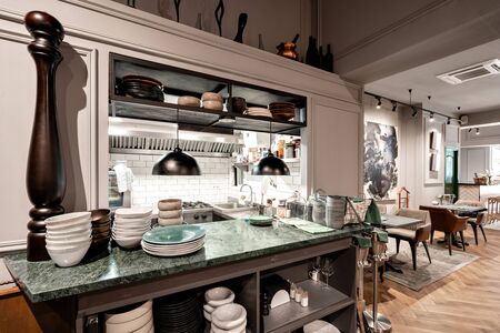Spain, Barcelona - October 22 2019. Restaurant Vinogrado. Open kitchen. Restaurant and bar interior. Modern european small cozy restaurantのeditorial素材