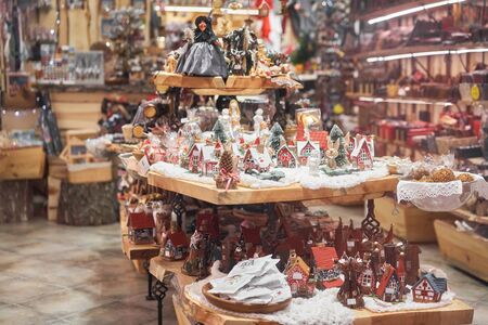 Riga, Latvia - December 08 2019. Gift shop. Souvenirs. People buying traditional souvenirs at a European Christmas market.のeditorial素材