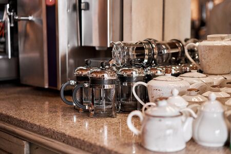 Group of empty cups and teapots in many rows. Tableware for coffee and tea in breakfast and seminar event.の写真素材