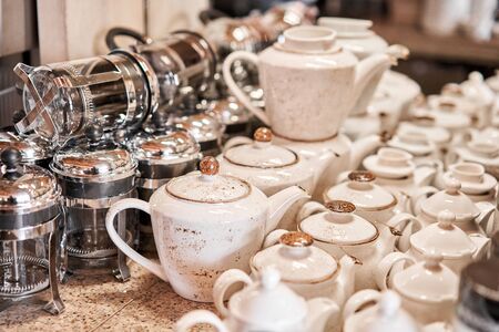 Group of empty cups and teapots in many rows. Tableware for coffee and tea in breakfast and seminar event.の写真素材
