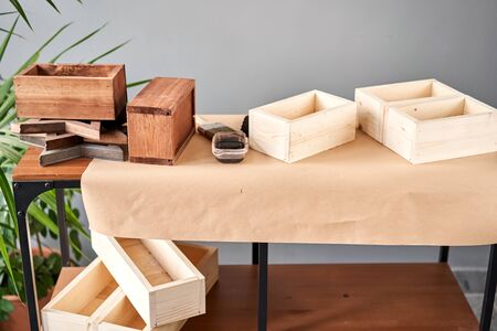 A set of blanks of wooden boxes for flower compositions. Small business woodwork workshop. In your...