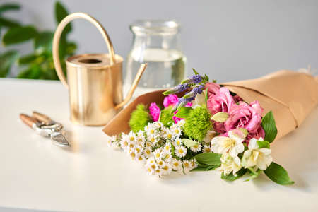 step by step installation of flowers in a vase. Flowers bunch, set for home. Fresh cut flowers for...