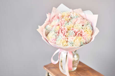 Bunches of rainbow carnation flowers different varieties in vases. Lovely Vintage background with flowers. Wallpapers. Clove bunch present for Mothers Day.の写真素材