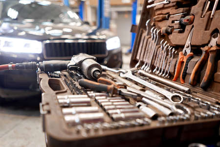 Dirty set of tools and wrenches close-up in box. Technical service station for car. Tool to repair the car or replace automotive spare parts, auto parts.の写真素材