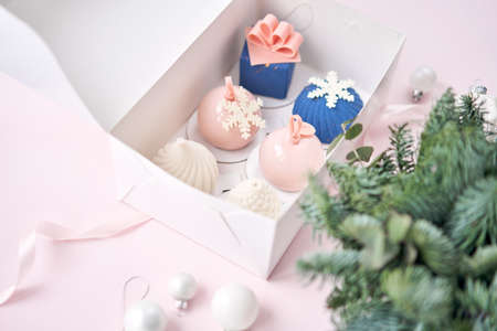 Merry Christmas card. Variety of sweet delicious cakes. Fir branches on a gray background. Merry Christmas card. New year moodの写真素材