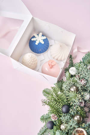 Merry Christmas card. Variety of sweet delicious cakes. Fir branches on a gray background. Merry Christmas card. New year moodの写真素材