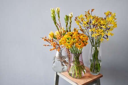 Set of yellow nd orange flowers for Interior decorations. The work of the florist at a flower shop. Fresh cut flower. European floral shop. Delivery fresh cut flowerの写真素材