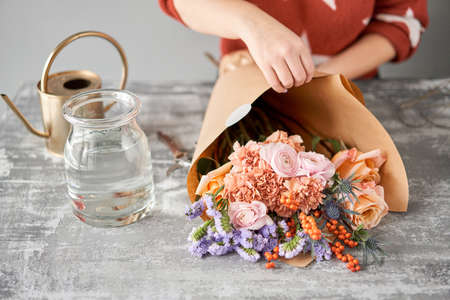 Unpacking Flowers bunch, set for home. Fresh cut flowers for decoration home. European floral shop. Delivery fresh cut flower.の写真素材