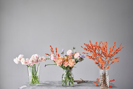 Finished flower arrangement in a vase for home. Flowers bunch, set for interior. Fresh cut flowers for decoration home. European floral shop. Delivery fresh cut flower.の写真素材