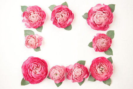 Floral frame. Petals of flowers, roses and ranunculus. Valentines day romantic background . Space...