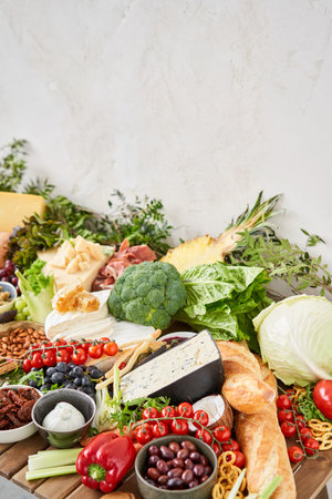 Table full of mediterranean appetizers, tapas or antipasto. Assorted Italian food set. Delicious snack on party or picnic time. Meat and cheese. Italian style banquet.の写真素材