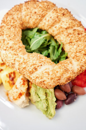 Turkish breakfast with simit, cheese, tomato, cucumber, olives. Breakfast with coffee in the...