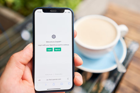 US, California - June 18 2023: ChatGPT chat bot screen seen on smartphone and laptop display with Chat GPT login screen on the background. A new AI chatbot by OpenAI.のeditorial素材