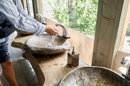 Teapot with tea and delicious National Kazakh pastries baursak. Street cafe in the highlands with a view of the mountains.. Fry dough in boiling oil in a frying pan.の写真素材