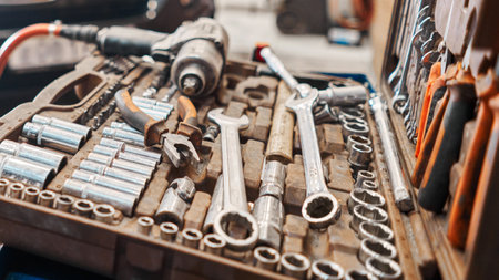 Dirty set of tools and wrenches close-up in box. Technical service station for car. Tool to repair the car or replace automotive spare parts, auto parts.の写真素材