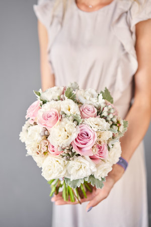 Bridal bouquet. The brides . Beautiful of white flowers and greenery, decorated with silk ribbon.の写真素材