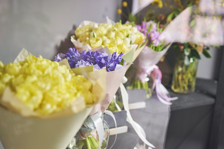 Ready-made bouquets for sale. Many different flowers on Showcase. Background of mix of flowers. Beautiful flowers for catalog or online store. Floral shop and delivery concept.の写真素材