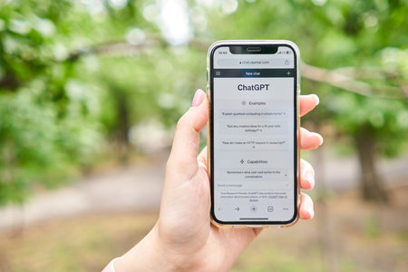 US, California - June 18 2023: ChatGPT chat bot screen seen on smartphone and laptop display with Chat GPT login screen on the background. A new AI chatbot by OpenAI.のeditorial素材