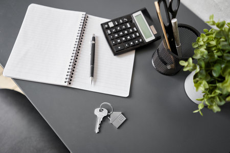 Office desk table with supplies, paper, calculator. Top view with copy space. Selective focus....