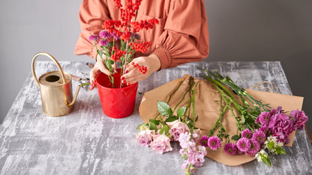 Step by step installation of flowers in a vase. Flowers bunch, set for home. Fresh cut flowers for decoration home. European floral shop. Delivery fresh cut flower.の写真素材