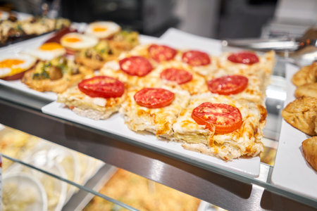 Various hot dishes . Glass Showcase in a buffet or self-service restaurant.の写真素材