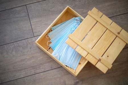 Medical mask as a gift for Valentine's Day. Red heart and blue maskの写真素材