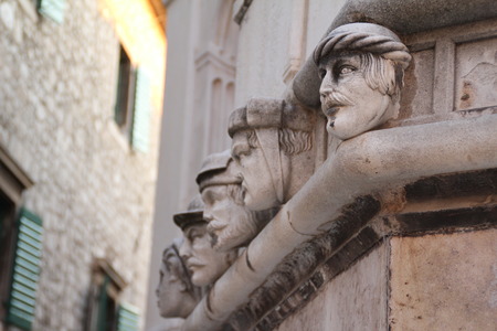 Famous faces on the side protal of Sibenik cathedralの写真素材