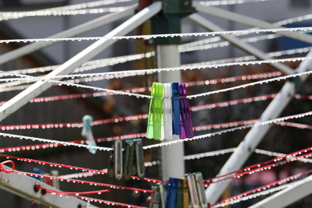 Close up of a colored clothespins on a clotheslineの写真素材