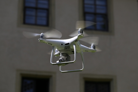 A flying drone armed with camera