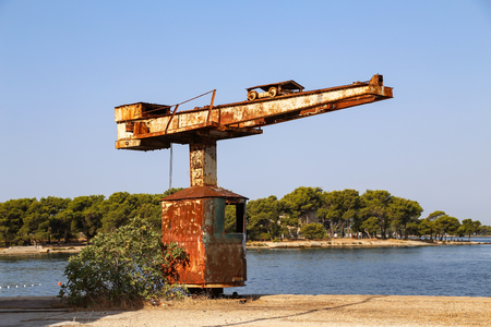 Old tap on the beach / Old crane for boatsの写真素材