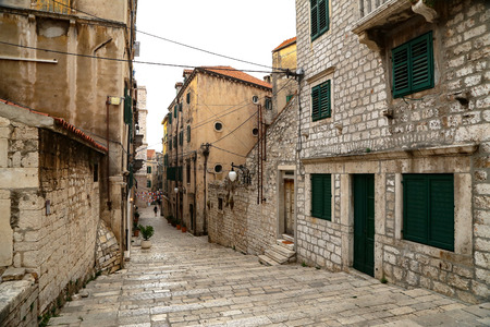 Tourist city by the Adriatic sea - Sibenik, Croatia. The old stones, narrow street and stairs.の写真素材