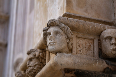 Sibenik cathedral / Famous faces on the side protal of Sibenik cathedralの写真素材