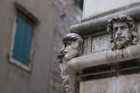 Sibenik cathedral / Famous faces on the side protal of Sibenik cathedralの写真素材