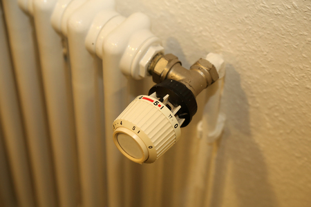 Panel heating with heat regulator. White radiatorの写真素材