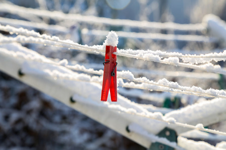 Close up of a colored clothespins on a clotheslineの写真素材