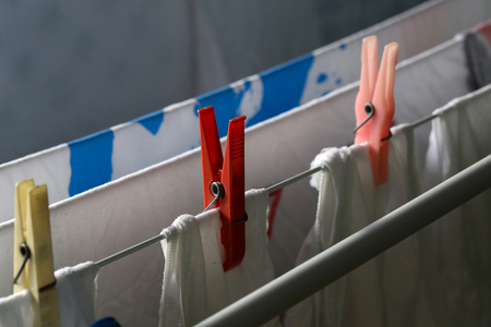 Clothespins hold stirannoe underwear to the dryerの写真素材