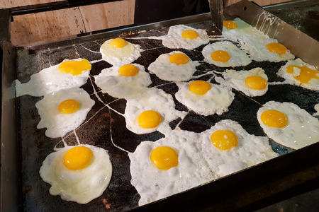 Fried eggs are fried in a frying panの写真素材