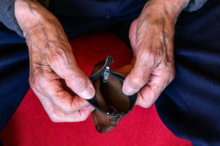 Pension / Empty wallet in the hands of an old manの写真素材