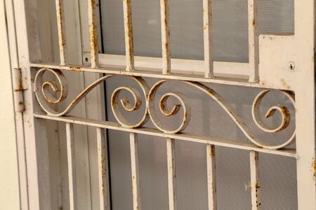 Windows with metal grilles / lattices on the windows
