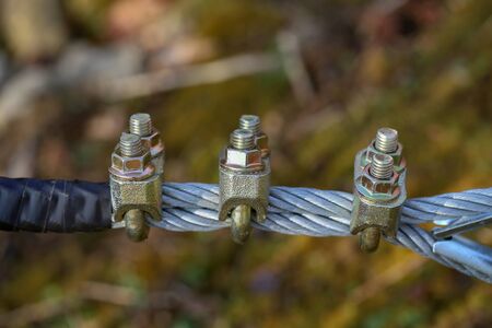 Bolts and nuts / Cable with bolts and nutsの写真素材