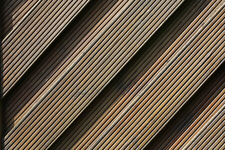 Fence from gray plastic material imitating woodの写真素材