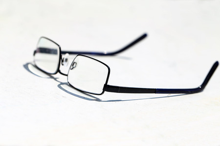 Reading glasses on the tableの写真素材