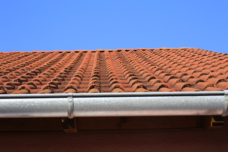 Old tiled roof on a stone house / details